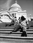 Old photo of people with disabilities struggling up the U.S. capitol stairs.